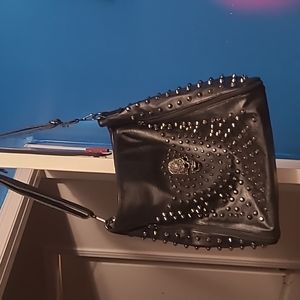 Skull purse missing one stud as shown in picture otherwise mint condition